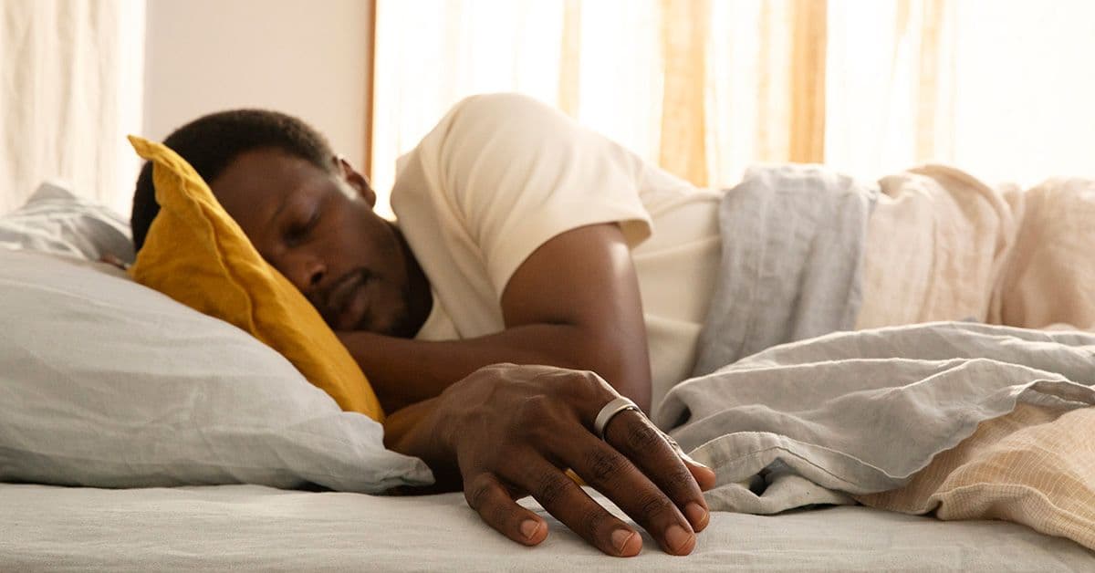 Person-Sleeping-With-an-Oura-Ring